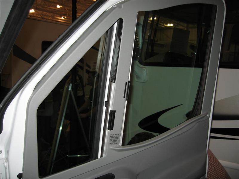 Side window blind found on the 2008 Itasca Navion, shown in open position